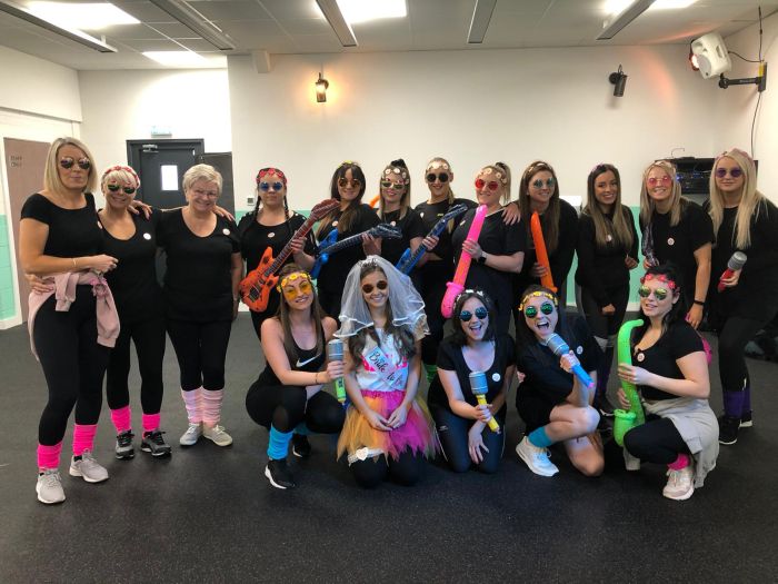 80s hen party dance class Leeds - group of women learning iconic 80s dance moves in city centre studio