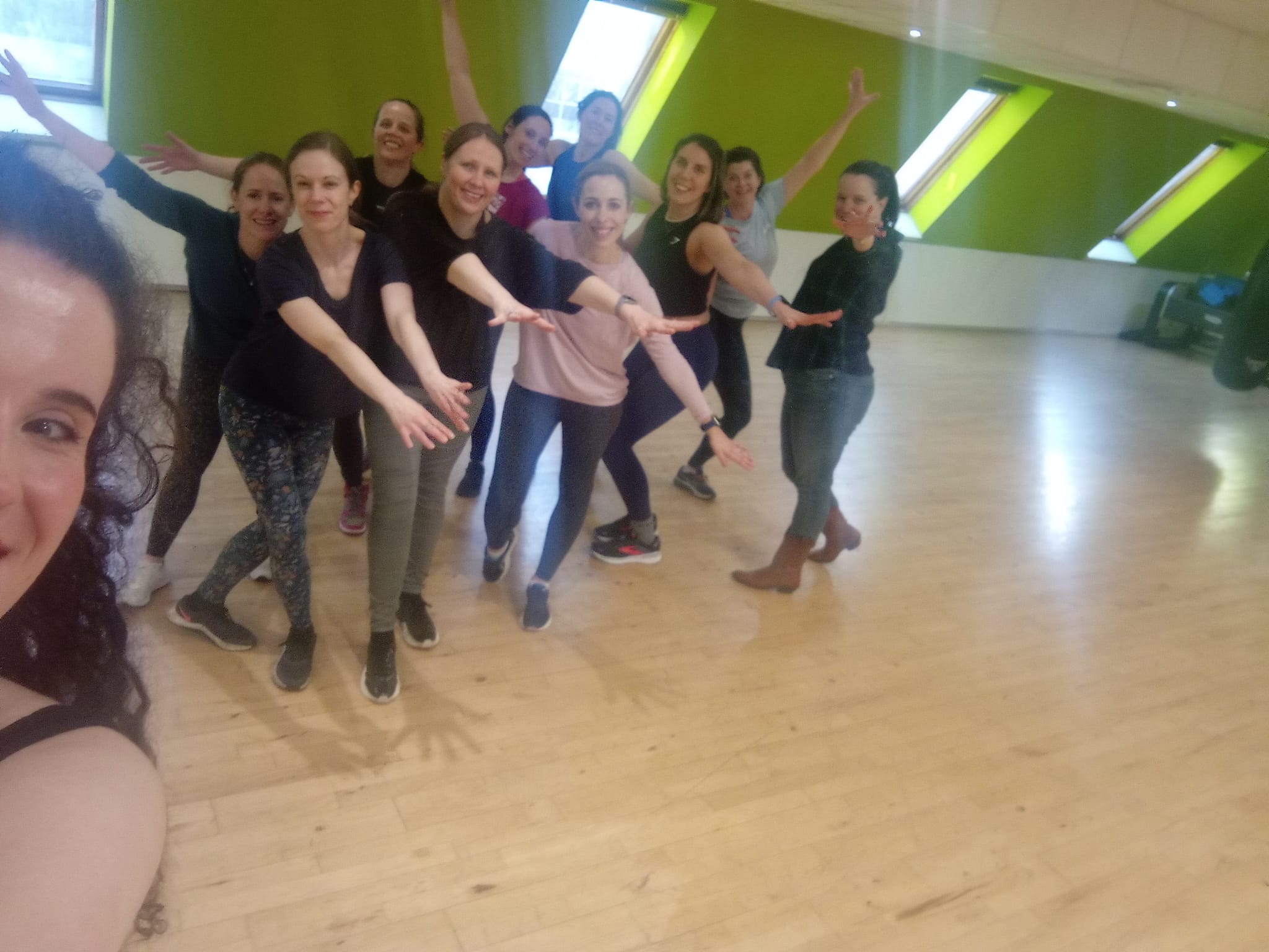 Barbie hen party dance class Leeds - group of women in pink outfits dancing in city centre studio