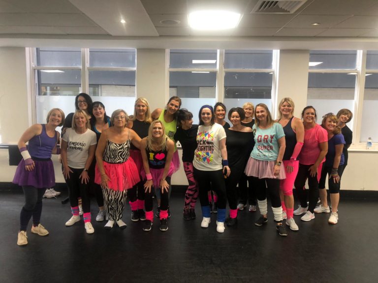 Flashdance hen party dance class Leeds - group learning iconic 80s moves and empowering choreography in city centre studio